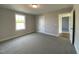 View of bedroom featuring neutral carpet and white trim at 4881 Grosbeak Ct, Mebane, NC 27302