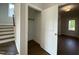 Entryway showcases hardwood floors, a closet, and access to the staircase at 4881 Grosbeak Ct, Mebane, NC 27302