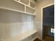 Mudroom with custom built-in shelving, storage, and bench seating at 4881 Grosbeak Ct, Mebane, NC 27302