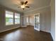 Bright office space featuring hardwood floors, elegant French doors, and a ceiling fan for added comfort at 4881 Grosbeak Ct, Mebane, NC 27302