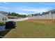 The backyard is expansive with a well-maintained lawn and a tall privacy fence at 50 Fontaine Dr, Franklinton, NC 27525