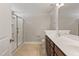 Bathroom with a double sink vanity, walk-in shower, and tile flooring at 50 Fontaine Dr, Franklinton, NC 27525