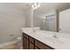 Bright bathroom with dual sinks and modern vanity paired with a glass-enclosed shower at 50 Fontaine Dr, Franklinton, NC 27525