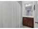 Bathroom with shower featuring a shower curtain and vanity with a dark wood finish at 50 Fontaine Dr, Franklinton, NC 27525