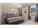 Nicely decorated bedroom with a large bed, bench, side tables, and natural light at 50 Fontaine Dr, Franklinton, NC 27525