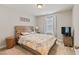 Bedroom featuring a wooden headboard and large window at 50 Fontaine Dr, Franklinton, NC 27525