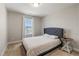 Cozy bedroom with carpet, natural light, and blue upholstered headboard at 50 Fontaine Dr, Franklinton, NC 27525