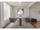 Dining room with modern decor, including a contemporary table and chairs, stylish light fixture and decor at 50 Fontaine Dr, Franklinton, NC 27525