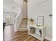 Inviting entryway with hardwood floors, stairs leading up, and a decorative console table at 50 Fontaine Dr, Franklinton, NC 27525