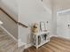 Inviting entryway with hardwood floors, stairs leading up, and a decorative console table at 50 Fontaine Dr, Franklinton, NC 27525