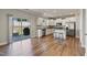 Open kitchen layout with stainless steel appliances, a center island, and access to the backyard at 50 Fontaine Dr, Franklinton, NC 27525