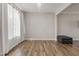 Bright, airy room featuring hardwood floors, decorative light fixture and large window for ample natural light at 50 Fontaine Dr, Franklinton, NC 27525