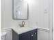 Chic bathroom with white shiplap, dark vanity, and modern fixtures at 512 Trail Of Merlin, Garner, NC 27529