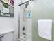 Bathroom shower with white towel rack and floral wall art, creating a serene and stylish space at 512 Trail Of Merlin, Garner, NC 27529