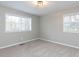 Bedroom featuring carpet, overhead lighting, and natural light from the windows at 512 Trail Of Merlin, Garner, NC 27529