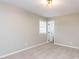 Neutral bedroom with carpet flooring, overhead lighting, and a window at 512 Trail Of Merlin, Garner, NC 27529