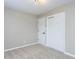 Bedroom featuring neutral walls, carpet, two closets with sliding doors, and white trim at 512 Trail Of Merlin, Garner, NC 27529