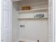 Functional closet space with built-in shelves, suitable for linens and laundry needs at 512 Trail Of Merlin, Garner, NC 27529