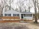 Charming single-story home featuring brick accents, neutral siding, and mature trees at 512 Trail Of Merlin, Garner, NC 27529