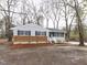Charming single-story home with brick and siding exterior, landscaped front yard at 512 Trail Of Merlin, Garner, NC 27529