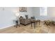 Spacious living room with hardwood floors, neutral-colored furniture, and ample seating at 512 Trail Of Merlin, Garner, NC 27529