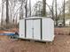 Utility shed provides practical storage, nestled among backyard trees, and a space for projects at 512 Trail Of Merlin, Garner, NC 27529