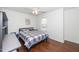 Cozy bedroom features hardwood floors, ample natural light, and a ceiling fan at 521 Renshaw Ct, Cary, NC 27518