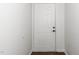 Simple entryway with a white door, neutral walls, and dark trim at 521 Renshaw Ct, Cary, NC 27518