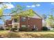 Charming two-story brick home with a private balcony and manicured landscaping in a serene setting at 521 Renshaw Ct, Cary, NC 27518