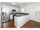 Modern kitchen features stainless steel appliances, sleek countertops, and ample cabinet space at 521 Renshaw Ct, Cary, NC 27518