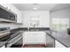 Well-lit kitchen with stainless appliances, modern countertops, and a practical layout at 521 Renshaw Ct, Cary, NC 27518
