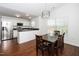 Eat-in kitchen with granite countertops, stainless steel appliances, and a dining table at 521 Renshaw Ct, Cary, NC 27518
