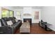Cozy living room with a fireplace, comfortable seating, and wood floors at 521 Renshaw Ct, Cary, NC 27518