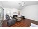 Cozy living room with a fireplace, comfortable seating, and wood floors at 521 Renshaw Ct, Cary, NC 27518