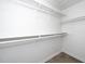 Bright walk-in closet featuring built-in shelving and ample storage space, perfect for organization and convenience at 521 Renshaw Ct, Cary, NC 27518