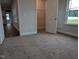 Bedroom features neutral carpet and doorway to closet at 530 Sweet Potato Lane # 41, Nashville, NC 27856