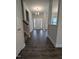 Inviting entryway with dark wood floors, neutral paint, and a view of the dining room at 530 Sweet Potato Lane # 41, Nashville, NC 27856