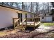 Exterior of a home showing a new wooden deck and backyard at 5635 Paragon Cir, Durham, NC 27712