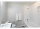Bright bathroom featuring subway tile, a tub-shower combo and a modern vanity at 5635 Paragon Cir, Durham, NC 27712