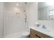 Modern bathroom featuring a walk-in shower with subway tile and a stylish vanity with a wood cabinet at 5635 Paragon Cir, Durham, NC 27712
