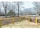 Wooden deck and backyard view showcasing ample space for outdoor activities and relaxation at 5635 Paragon Cir, Durham, NC 27712