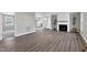 Spacious living room featuring a decorative fireplace, modern flooring and neutral paint color at 5635 Paragon Cir, Durham, NC 27712