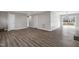 Spacious living room featuring modern flooring, neutral paint colors, and a view of the patio at 5635 Paragon Cir, Durham, NC 27712