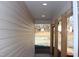 Covered porch with recessed lighting and wooden support columns overlooks front yard at 5635 Paragon Cir, Durham, NC 27712
