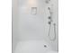 Bright shower with subway tile, a built-in niche, and adjustable shower head at 5635 Paragon Cir, Durham, NC 27712