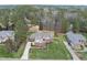 Expansive brick home with manicured lawn and mature trees in established neighborhood at 6 Kersey Ct, Durham, NC 27713