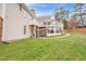 Large backyard with a spacious two-story deck, decorative string lights and cloth at 6 Kersey Ct, Durham, NC 27713