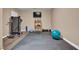 Finished basement featuring a home gym area with exercise equipment and rubber flooring at 6 Kersey Ct, Durham, NC 27713