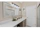 Clean bathroom with a large mirror, vanity, and a glass-enclosed shower, providing a modern and functional space at 6 Kersey Ct, Durham, NC 27713