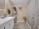 Bathroom with a single sink vanity and a butterfly-themed shower curtain and decor at 6 Kersey Ct, Durham, NC 27713